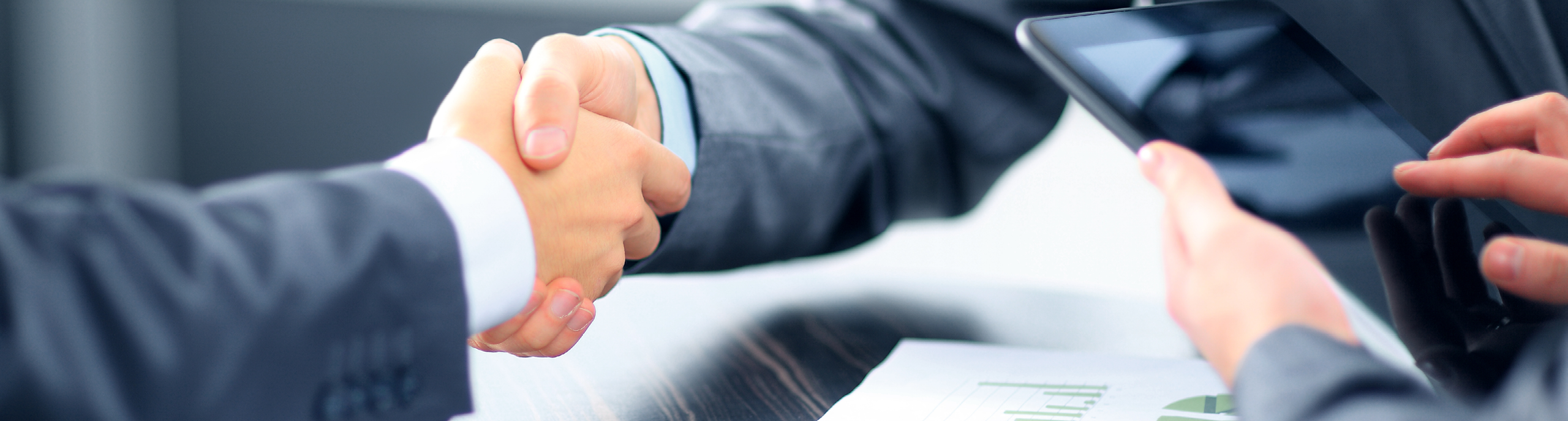 Business people shaking hands in office