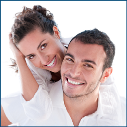 Smiling young couple piggyback at beautiful summer beach